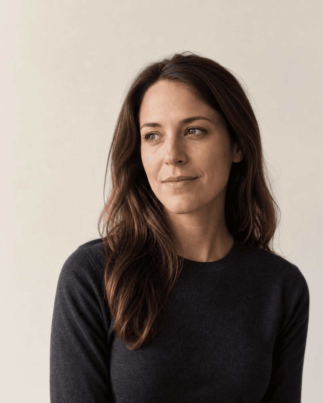 Thoughtful woman in a minimal studio portrait